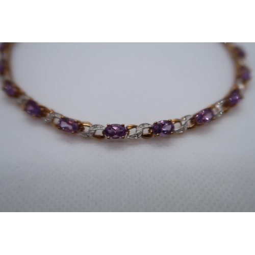 57 - A 9ct yellow gold amethyst and diamond figure of eight bracelet, boxed - Oval cut amethysts 5.50ct a... 