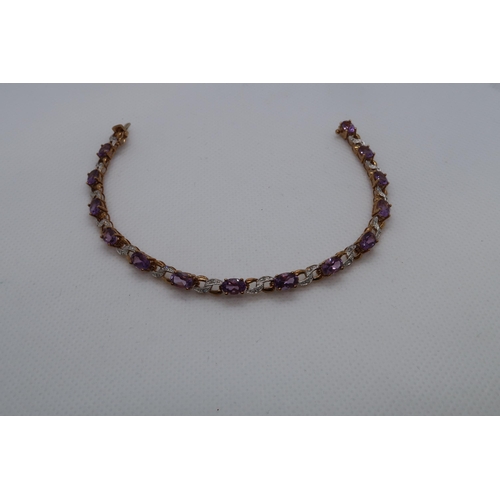 57 - A 9ct yellow gold amethyst and diamond figure of eight bracelet, boxed - Oval cut amethysts 5.50ct a... 