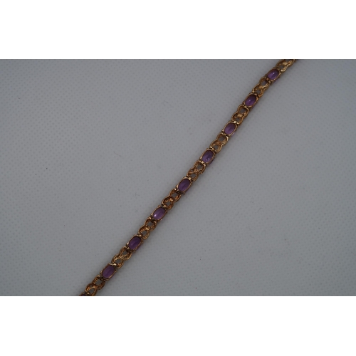 57 - A 9ct yellow gold amethyst and diamond figure of eight bracelet, boxed - Oval cut amethysts 5.50ct a... 