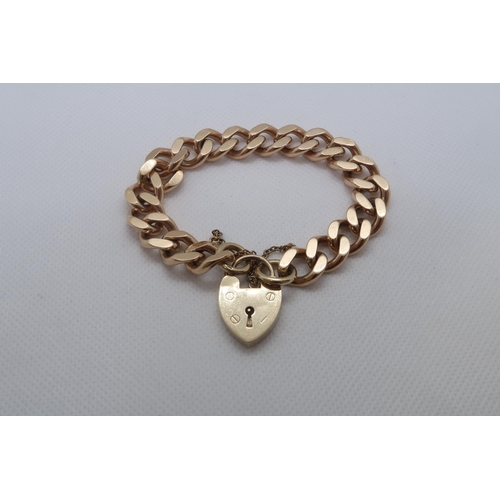 59 - A 9ct yellow gold (hallmarked) albert link bracelet with heart lock - 48.5 grams