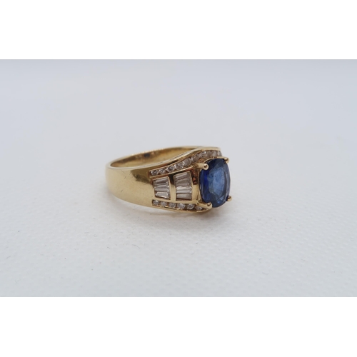 62 - A good sapphire and diamond ring - The central oval sapphire approx 8mmm x 6mm with 14 baguette cut ... 