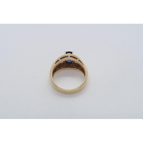 62 - A good sapphire and diamond ring - The central oval sapphire approx 8mmm x 6mm with 14 baguette cut ... 