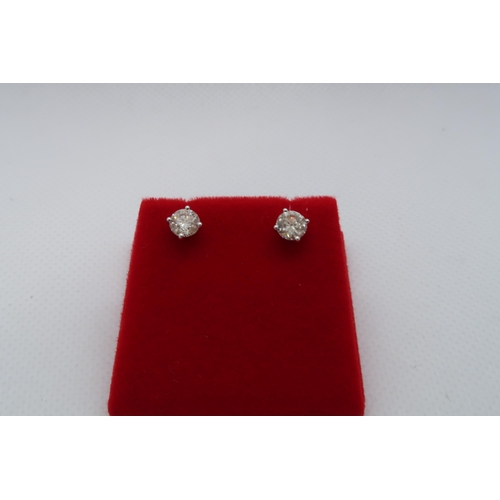 63 - A pair of 18ct white gold solitaire diamond studs, boxed - Round Brilliant Cut diamonds 1.15ct