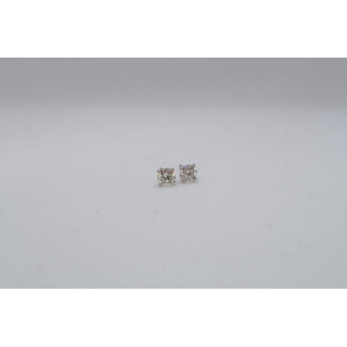 63 - A pair of 18ct white gold solitaire diamond studs, boxed - Round Brilliant Cut diamonds 1.15ct