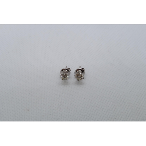 63 - A pair of 18ct white gold solitaire diamond studs, boxed - Round Brilliant Cut diamonds 1.15ct