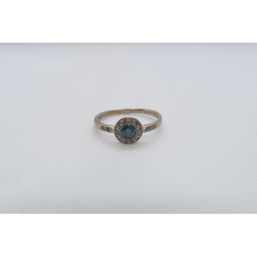 64 - A 14ct white gold (hallmarked) blue diamond ring - the central round brilliant cut blue diamond appr... 