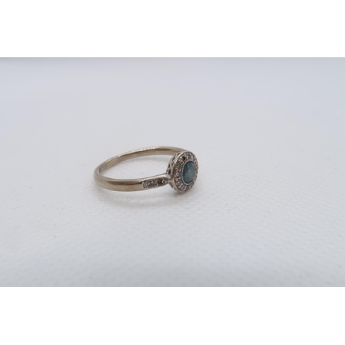 64 - A 14ct white gold (hallmarked) blue diamond ring - the central round brilliant cut blue diamond appr... 