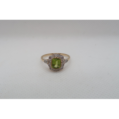 67 - A 9ct yellow gold Peridot and diamond ring with diamond shoulders - head size approx 11mm x 11mm - r... 