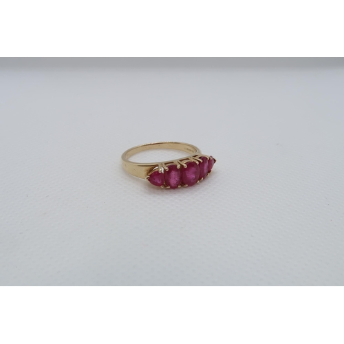 68 - A 14ct yellow gold (hallmarked) and ruby five stone bridge ring size R/S - weight approx 3.7 grams