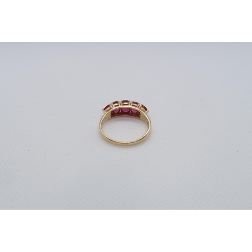 68 - A 14ct yellow gold (hallmarked) and ruby five stone bridge ring size R/S - weight approx 3.7 grams