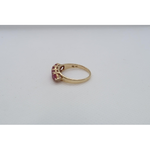 68 - A 14ct yellow gold (hallmarked) and ruby five stone bridge ring size R/S - weight approx 3.7 grams