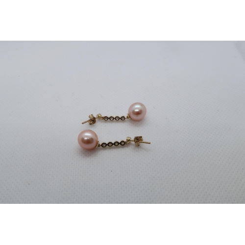 71 - A pair of 9ct yellow gold pink cultured pearl drop earrings with long bales set with diamonds, boxed... 