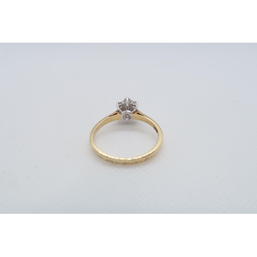 72 - An 18ct yellow gold (hallmarked) and diamond daisy cluster ring size V - approx weight 3.7 grams