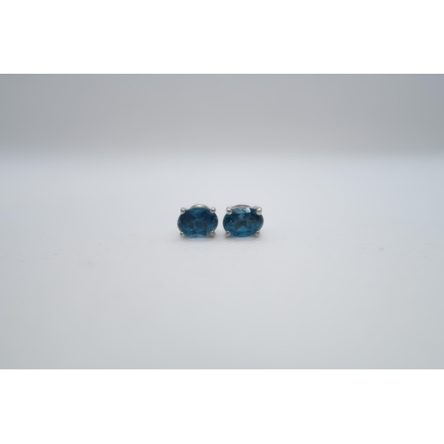 74 - A pair of London blue topaz studs in silver