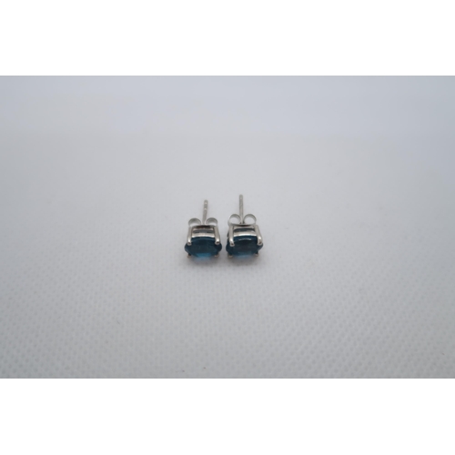 74 - A pair of London blue topaz studs in silver