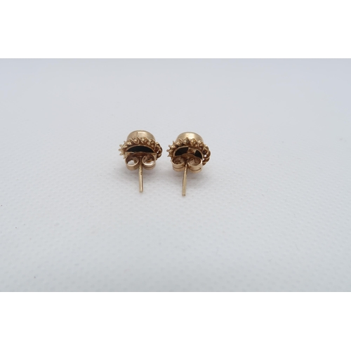 76 - A pair of 9ct yellow gold (hallmarked) doublet opal ear studs - Diameter 1cm - weight approx 1.7 gra... 