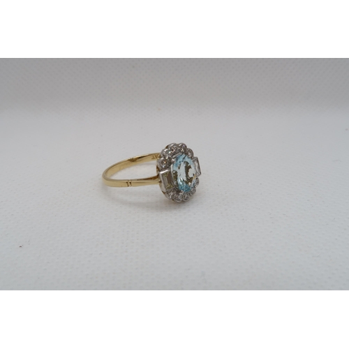 79 - An 18ct yellow gold and platinum Art Deco style aquamarine and diamond ring - diamonds are bright an... 