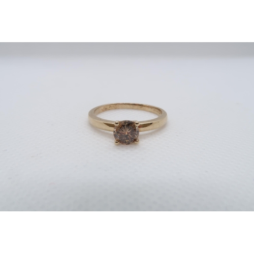 80 - A 9ct yellow gold (hallmarked) Cognac coloured diamond solitaire ring - The round brilliant cut diam... 