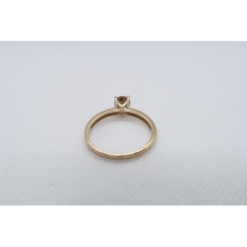 80 - A 9ct yellow gold (hallmarked) Cognac coloured diamond solitaire ring - The round brilliant cut diam... 