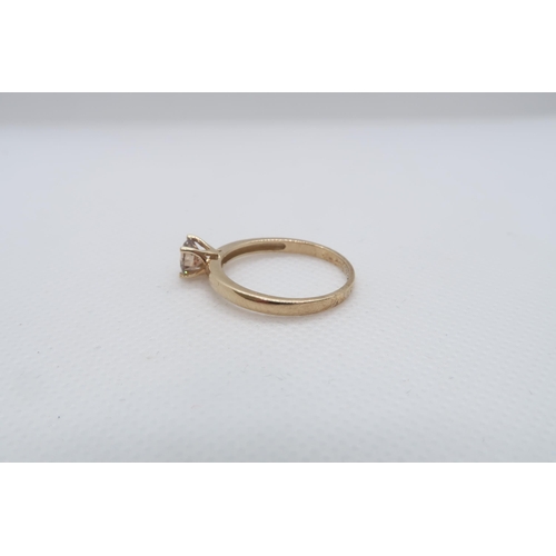 80 - A 9ct yellow gold (hallmarked) Cognac coloured diamond solitaire ring - The round brilliant cut diam... 