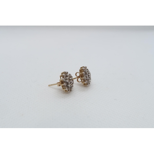 87 - A pair of 9ct yellow gold (hallmarked) diamond cluster ear studs - approx 11mm - approx weight 2.3 g... 