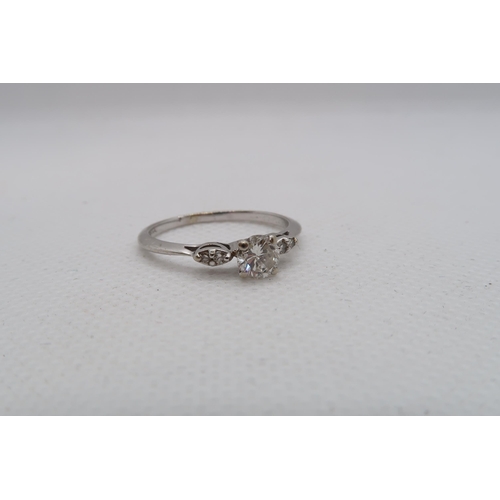 95 - A 14ct white gold diamond ring with diamond shoulders - centre diamond approx 0.5ct - diamonds are b... 