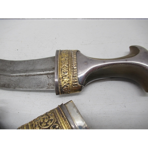 446 - A silver and gilt mounted Omani Khanjar dagger with horn handle - good overall condition, curved bla... 