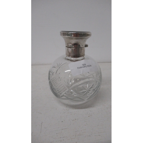 309 - A silver topped cut glass bottle with tortoiseshell and stopper, Birmingham 1928 - good overall cond... 