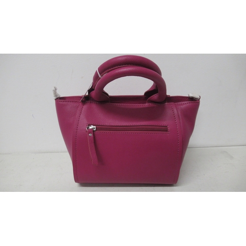 377 - A pink PIA hand bag with detachable shoulder strap, approx 28cm wide x 18cm high not including handl... 