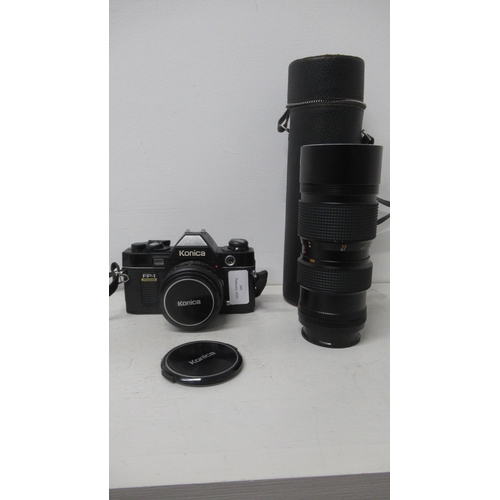 380 - A Konica FP1 programme camera and two lenses, Konica AR50mm F1.8 and a Konica 80-200 zoom lens - exc... 