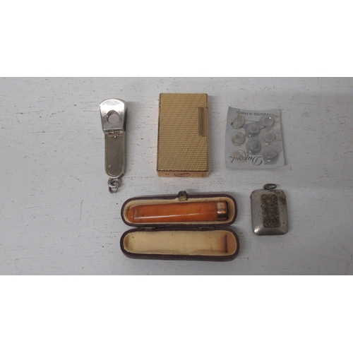 387 - A gold plated DuPont cigarette lighter, a silver cigar with another and an amber cheroot holder with... 