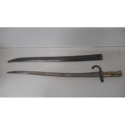 447 - A 19th century French Chassepot 'Yataghan' Bayonet in matching steel scabbard - blade approx 56cm