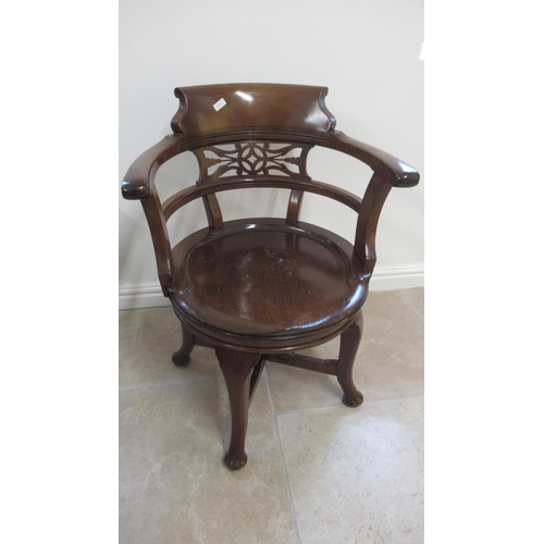 521 - A 19th century mahogany revolving desk chair in good condition for its age, mechanism working