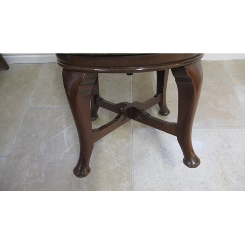 521 - A 19th century mahogany revolving desk chair in good condition for its age, mechanism working