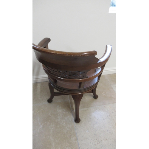 521 - A 19th century mahogany revolving desk chair in good condition for its age, mechanism working