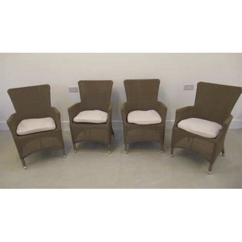 524 - A set of four Neptune rattan style garden chairs with cushions