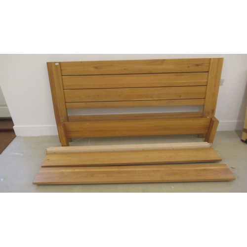 525 - A good quality oak super king size bed, 180cm complete with all of the fittings