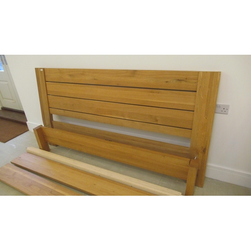 525 - A good quality oak super king size bed, 180cm complete with all of the fittings