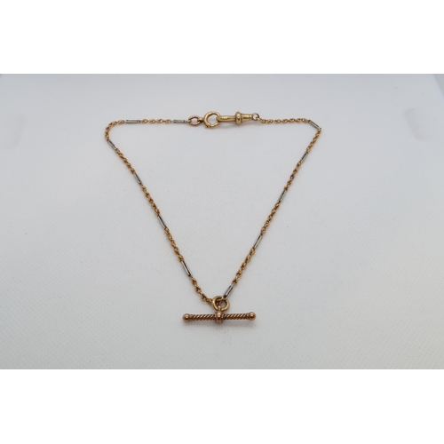 203 - An 18ct (hallmarked) bi colour chain with T bar - weight approx 11.7 grams - 33cm - one ring tested ... 