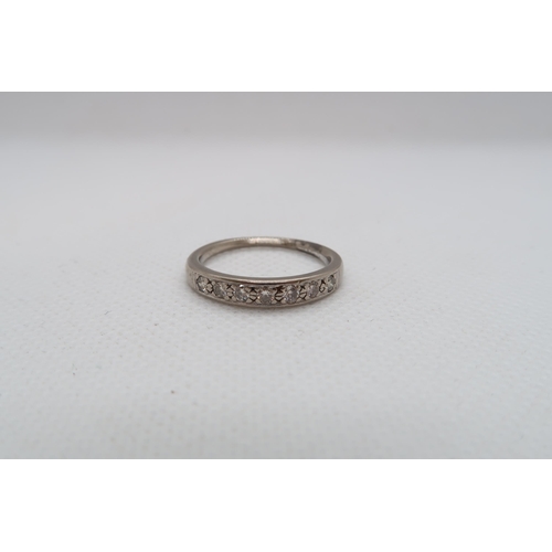 204 - An approx 18ct (Tested) white gold diamond half eternity ring size P/Q - approx weight 4.1 grams