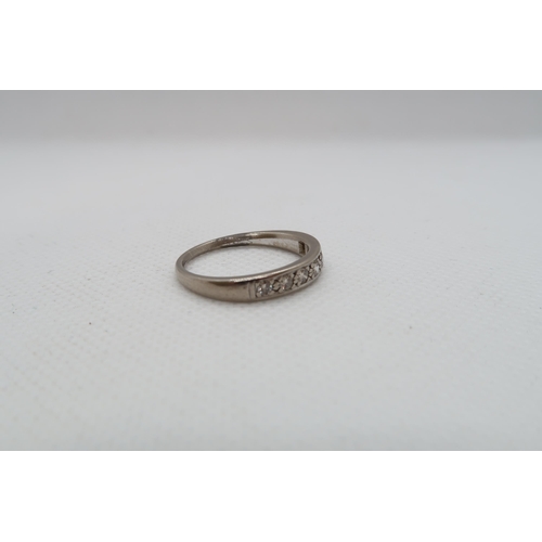 204 - An approx 18ct (Tested) white gold diamond half eternity ring size P/Q - approx weight 4.1 grams