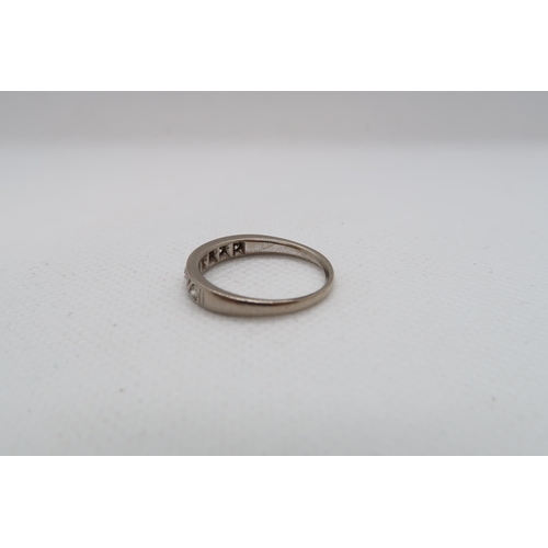 204 - An approx 18ct (Tested) white gold diamond half eternity ring size P/Q - approx weight 4.1 grams