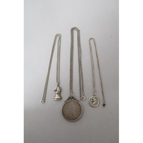 214 - Three silver pendant on chains including 1935 Liberty Dollar - approx weight 2 troy oz