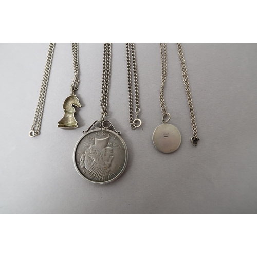 214 - Three silver pendant on chains including 1935 Liberty Dollar - approx weight 2 troy oz