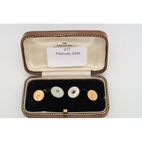 217 - Two 15ct (hallmarked) buttons with pearls - approx weight 2.6 grams - together with two mother of pe... 