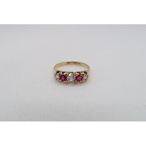 220 - An approx 18ct (tested) yellow gold ring with diamonds and rubies - ring size K/L - weight approx 2.... 