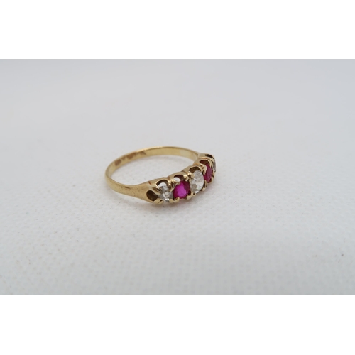 220 - An approx 18ct (tested) yellow gold ring with diamonds and rubies - ring size K/L - weight approx 2.... 