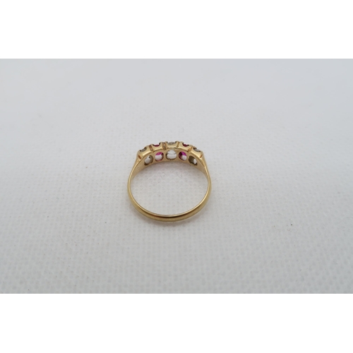 220 - An approx 18ct (tested) yellow gold ring with diamonds and rubies - ring size K/L - weight approx 2.... 