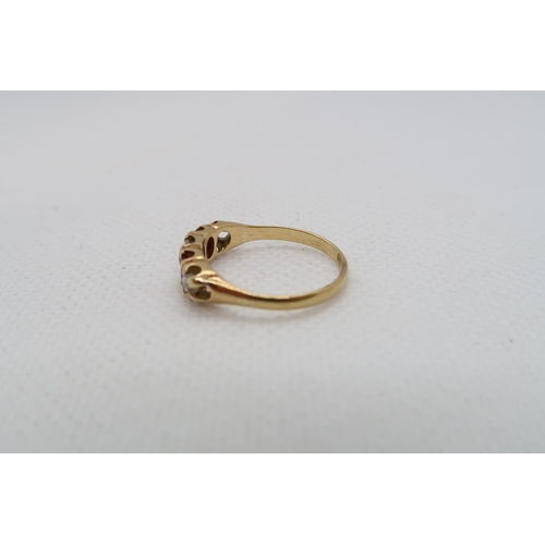 220 - An approx 18ct (tested) yellow gold ring with diamonds and rubies - ring size K/L - weight approx 2.... 