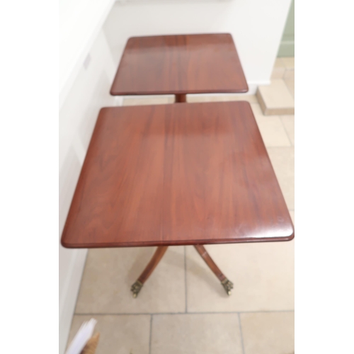 556 - A pair of mahogany lamp/hall tables with a 74cm x 74cm top